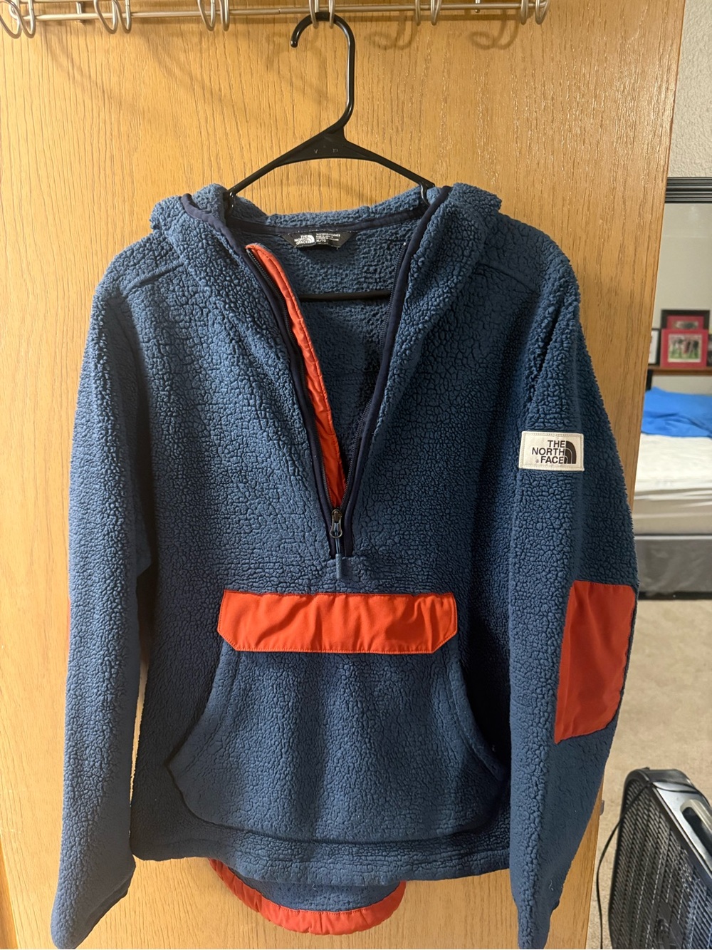 The North Face Kids Navy Blue Hooded Puffer Fleece with Orange Accents